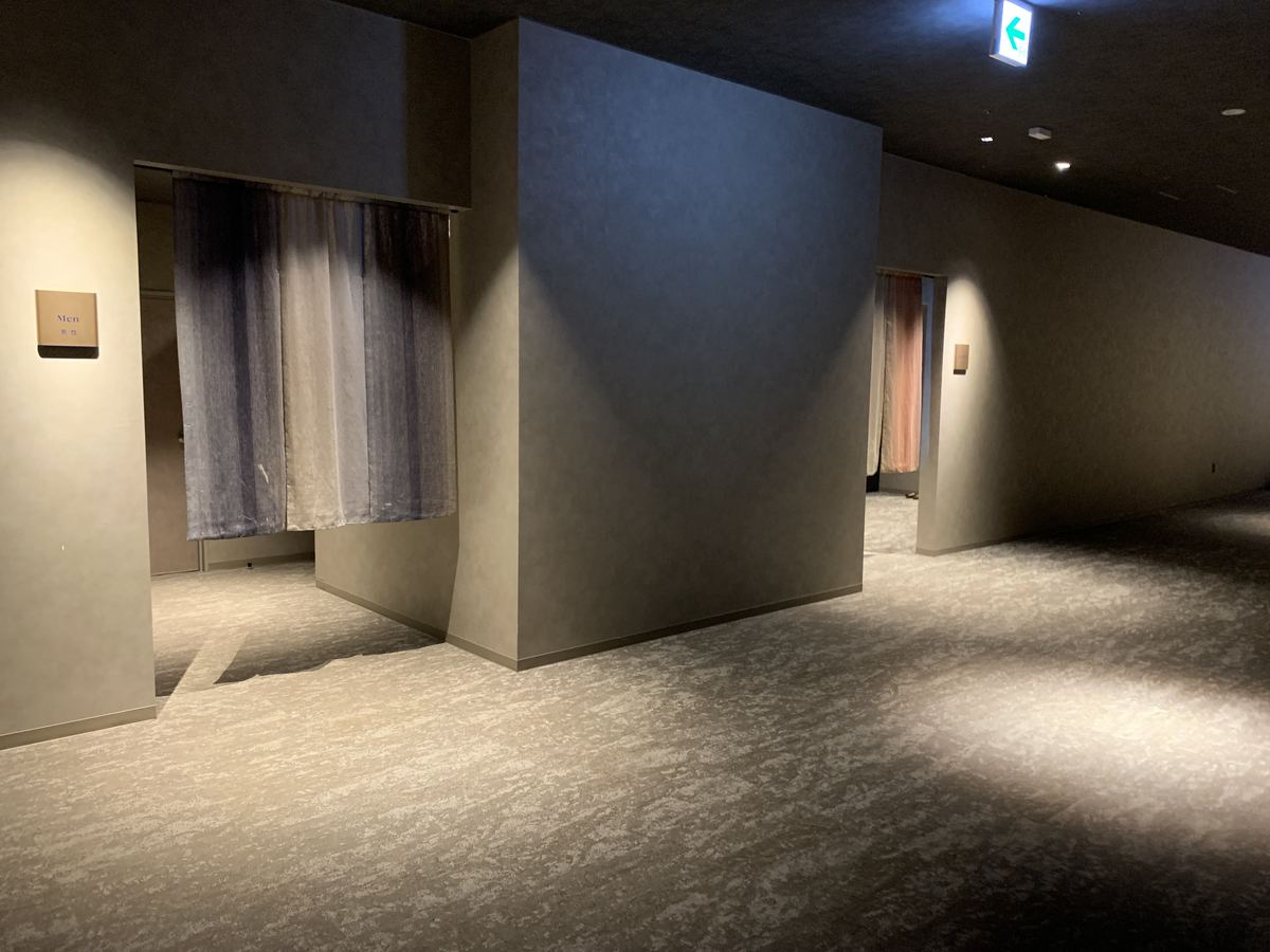 The entrance to the men's onsen baths at Grand Mercure Nasu Highlands, with indigo noren curtains and a 