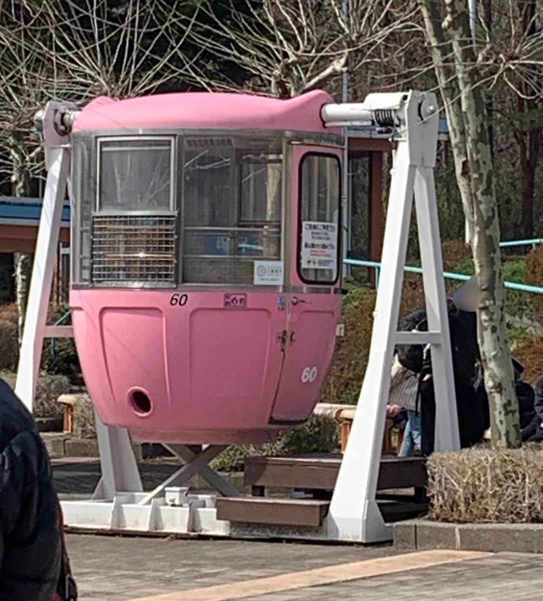 A pink retired ferris wheel gondola used as a photo spot