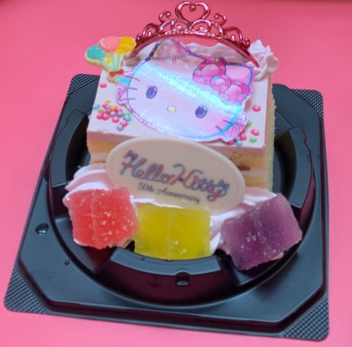 A Hello Kitty 50th-anniversary cake with a tiara decoration from the park's food shops